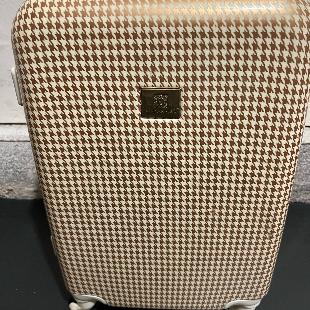 Carry on luggage with wheels.